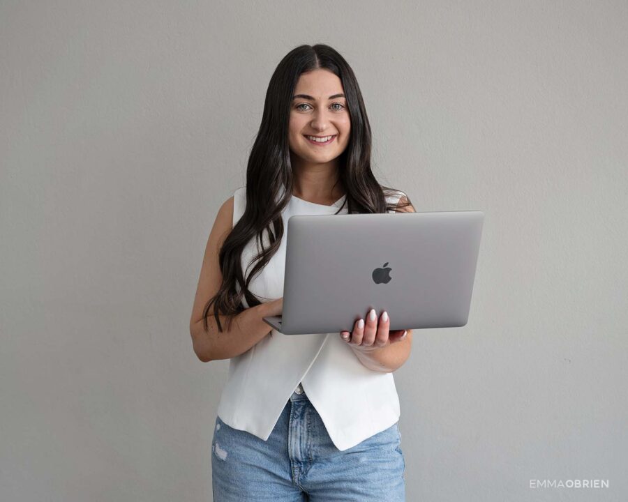 woman holding a laptop