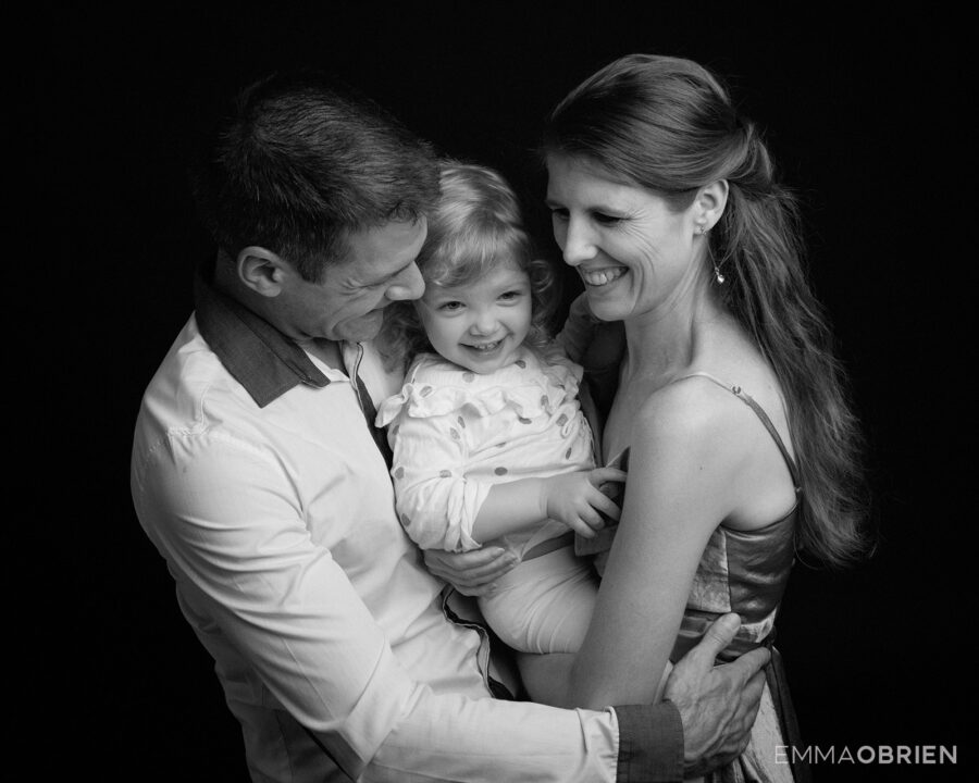 Couple holding two year old daughter