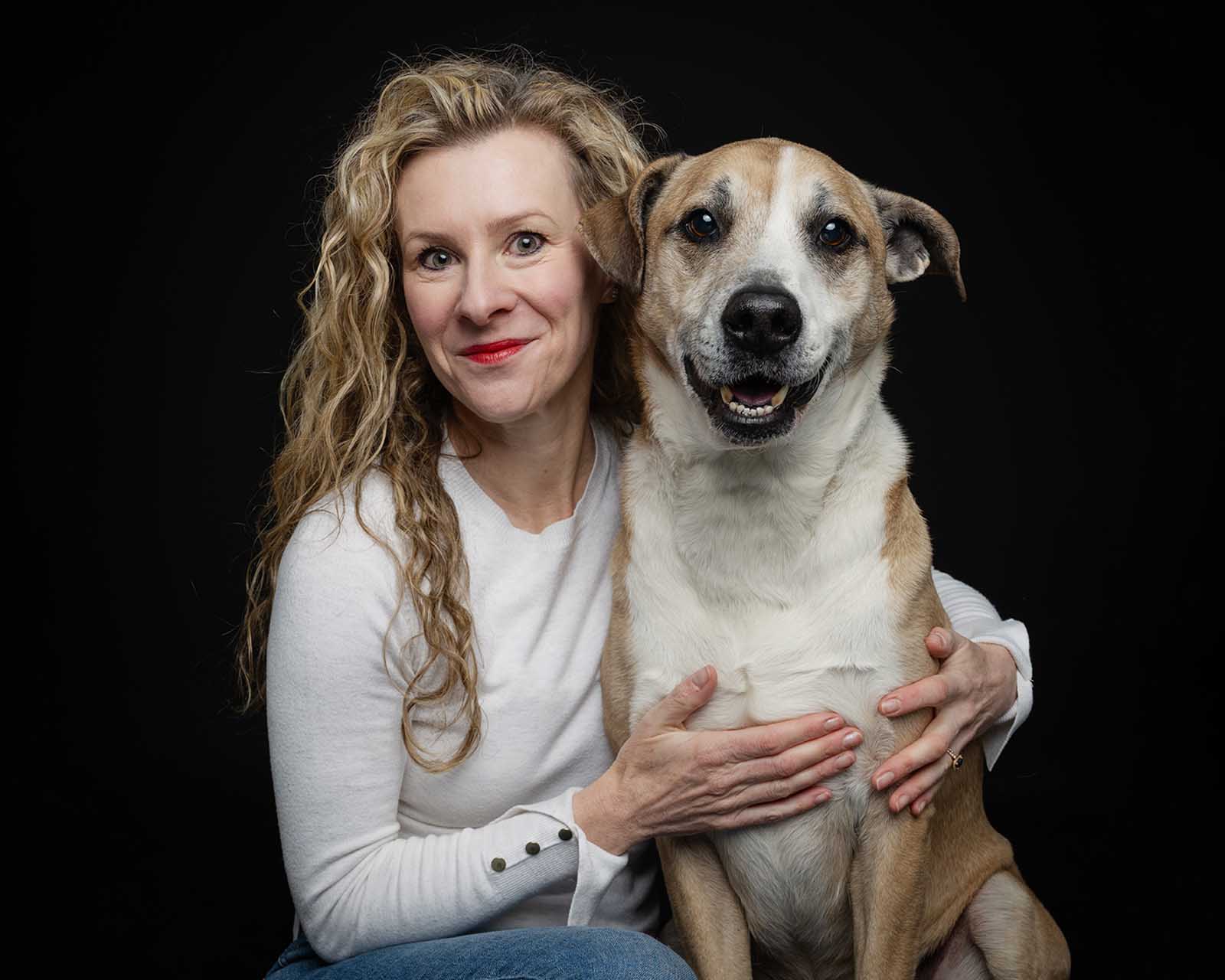 Woman and a mixed breed dog